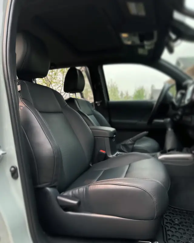 Black leather front seats in a Toyota Tacoma after an interior detail